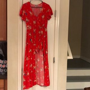 A red romper. Short in the front. Long in the back